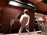 14 putting a pizza in the brick oven.jpg